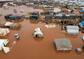 An aerial picture shows flooded tents after heavy rain at a camp for displaced Syrians near the town of Kafr Lusin by the border with Turkey, in the rebel-held northwestern province of Idlib on January 19, 2021. - Flooding following heavy rain at displacement camps in northwest Syria has killed a child and damaged or destroyed the tents of thousands of people, according to residents and aid workers. (Photo by Aaref WATAD / AFP)